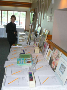 TLC Board member Doreen Johnston views items before the crowds arrive