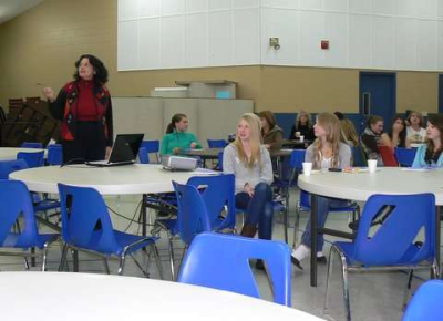 TLC Executive Director, Anne Acacia, talks to the girls at Victory Baptist Church 